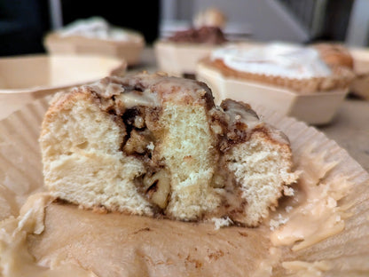 Walnut Praline Cinnamon Roll with Vanilla Glaze