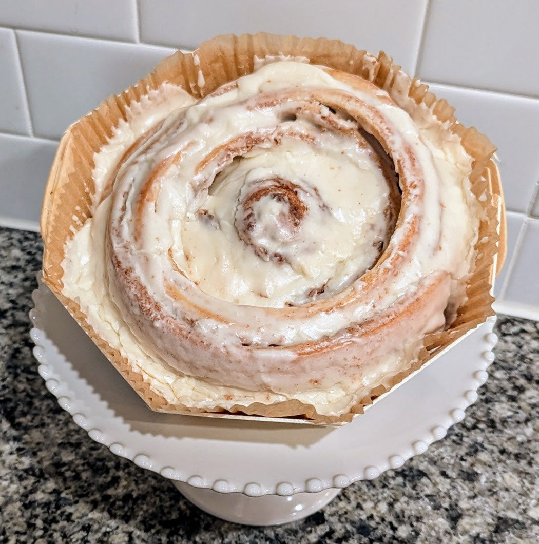 Colossal Cinnamon Roll topped with Cream Cheese Icing